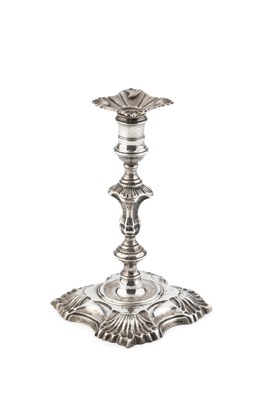 Lot A George II silver taperstick, having knopped...