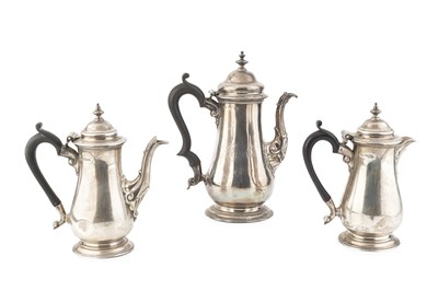 Lot A George II silver coffee pot, with domed and...