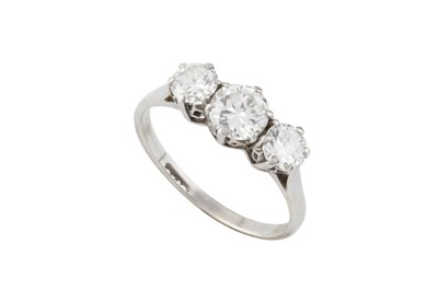 Lot 265 - A diamond three stone ring, the graduated...