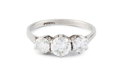 Lot 265 - A diamond three stone ring, the graduated...
