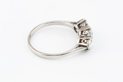 Lot 265 - A diamond three stone ring, the graduated...