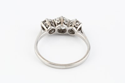 Lot 265 - A diamond three stone ring, the graduated...