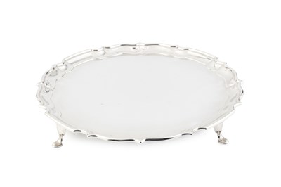 Lot 853 - A George V silver salver, with shaped piecrust...