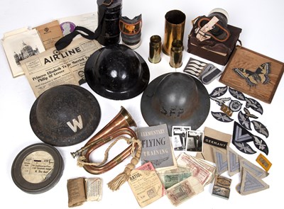 Lot 73 - WWII items to include three WWII helmets,...