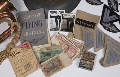 Lot 73 - WWII items to include three WWII helmets,...