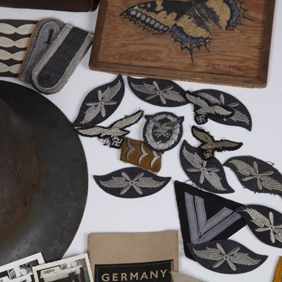Lot 73 - WWII items to include three WWII helmets,...