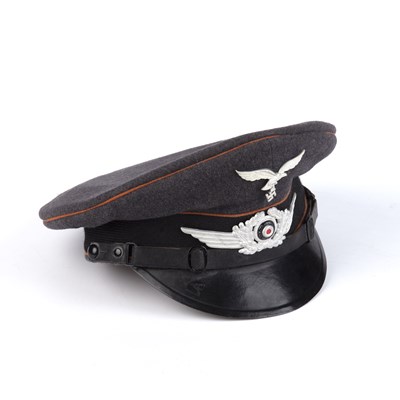 Lot 76 - A WWII German Luftwaffe signals visor cap, in...