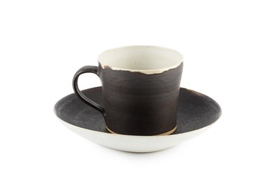 Lot 623 - Lucie Rie (1902-1995) Cup and saucer manganese...