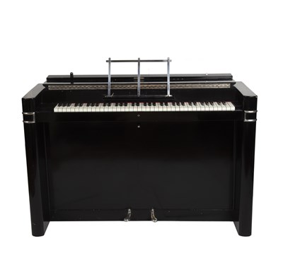 Lot 114 - An Eavestaff mini-piano in art deco style,...