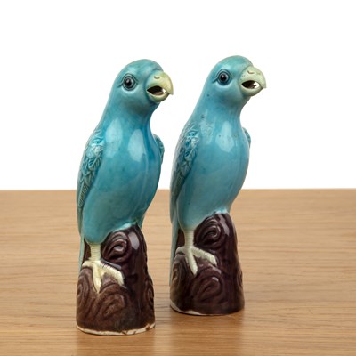 Lot 104 - Pair of turquoise and aubergine model parrots...