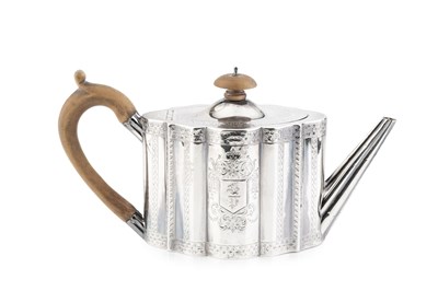 Lot 861 - A George III silver teapot, of shaped oval...