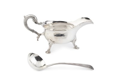 Lot 865 - A George V silver sauce boat, with shaped...