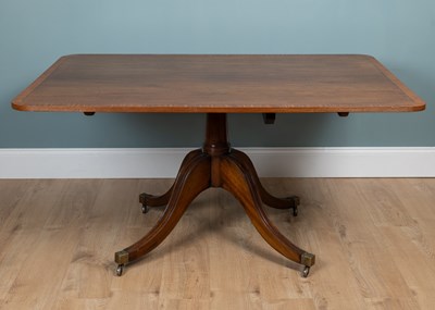 Lot 191 - A mahogany tilt-top dining table