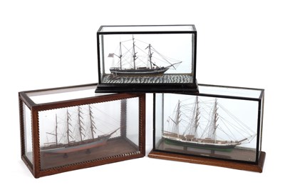 Lot 233 - Three early 20th century model ships in glazed...