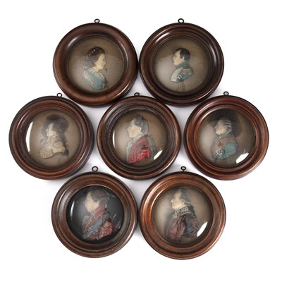 Lot 235 - A group of seven early 20th century wax...