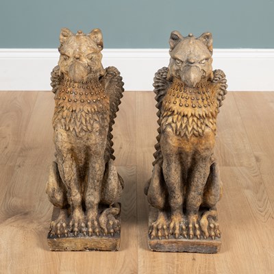 Lot 215 - A pair of old griffin finials