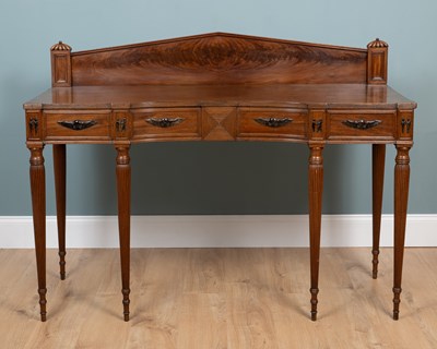 Lot 185 - A Georgian mahogany sideboard in the Egyptian style