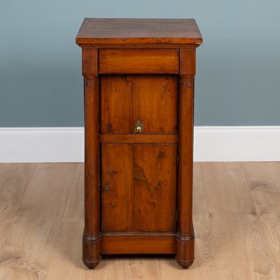 Lot 461 - A 19th century Empire-style yew wood bedside cupboard