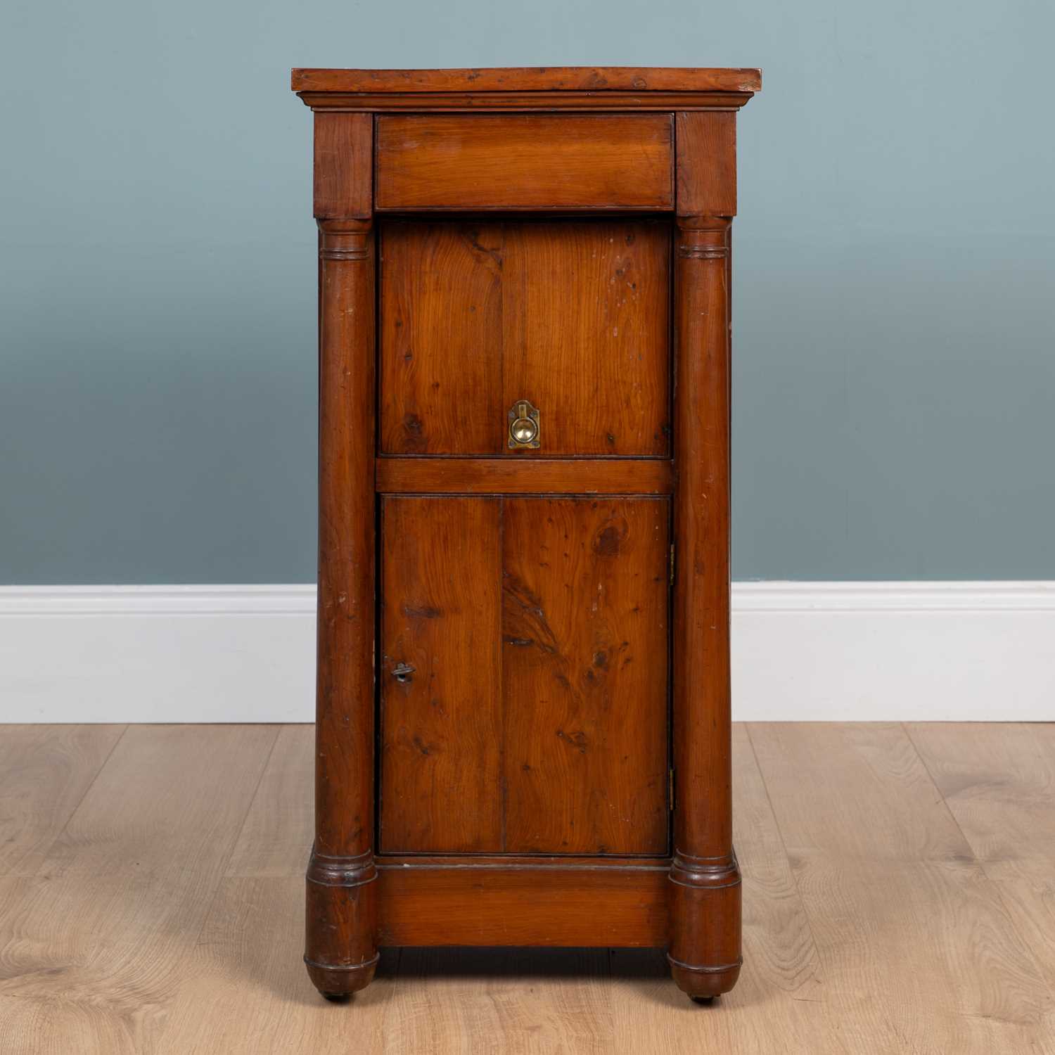 Lot 461 - A 19th century Empire-style yew wood bedside cupboard