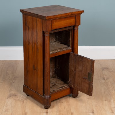 Lot 461 - A 19th century Empire-style yew wood bedside cupboard