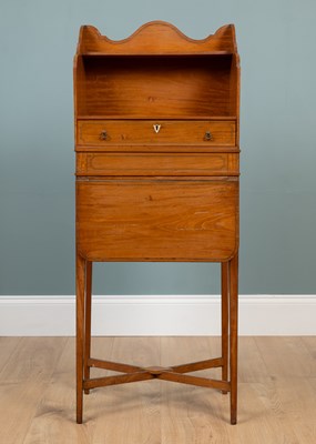 Lot 375 - A 19th century Sheraton-style satinwood book stand