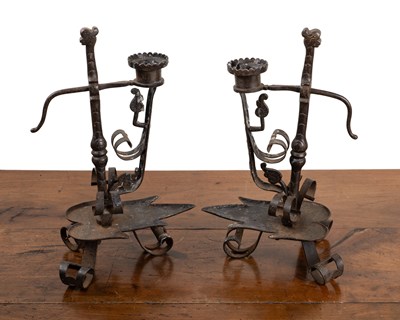 Lot 413 - A pair of 19th century Northern European wrought iron candlesticks