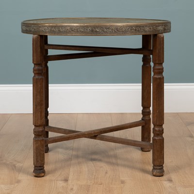 Lot 502 - An Indian circular brass tray topped occasional table