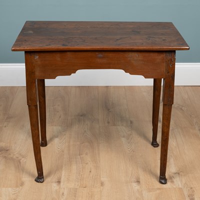 Lot 386 - An early 18th century yew wood centre table