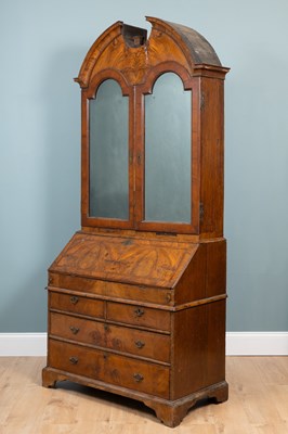 Lot 332 - A Queen Anne burr walnut and oak bureau bookcase