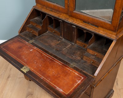 Lot 332 - A Queen Anne burr walnut and oak bureau bookcase