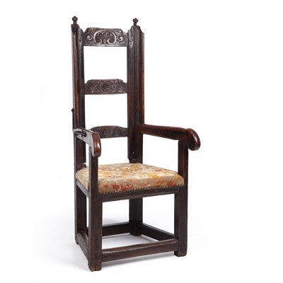 Lot 99 - A 17th century sleeping open armchair with a...