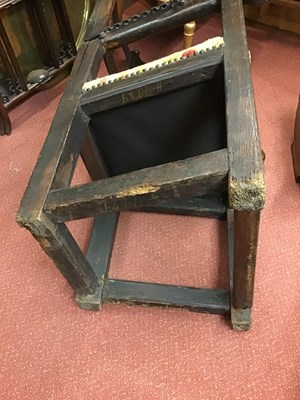 Lot 99 - A 17th century sleeping open armchair with a...