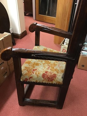 Lot 99 - A 17th century sleeping open armchair with a...
