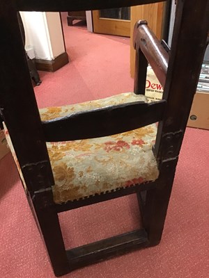Lot 99 - A 17th century sleeping open armchair with a...