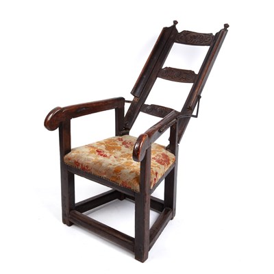 Lot 99 - A 17th century sleeping open armchair with a...
