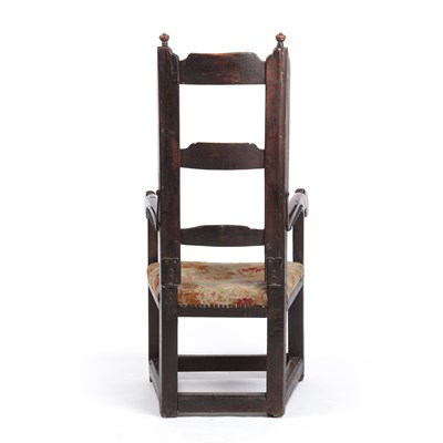 Lot 99 - A 17th century sleeping open armchair with a...