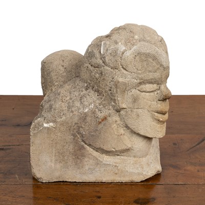 Lot 153 - A 20th-century limestone sculpture of the heads of the devil and a boy