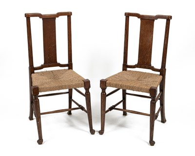 Lot 344 - A pair of William Morris oak side chairs