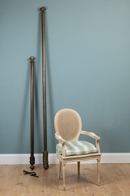 Lot 487 - A 20th century white-painted oval-back armchair and two curtain poles