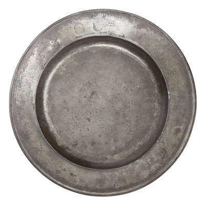 Lot 29 - A 17th century pewter broad rim charger by...