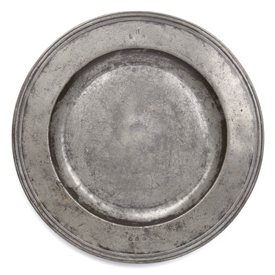 Lot 29 - A 17th century pewter broad rim charger by...