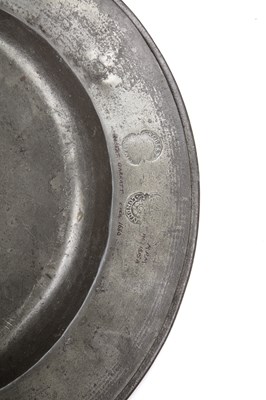 Lot 29 - A 17th century pewter broad rim charger by...