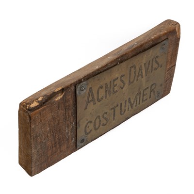 Lot 1069 - A brass name plaque for "Agnes Davis. Costumier."