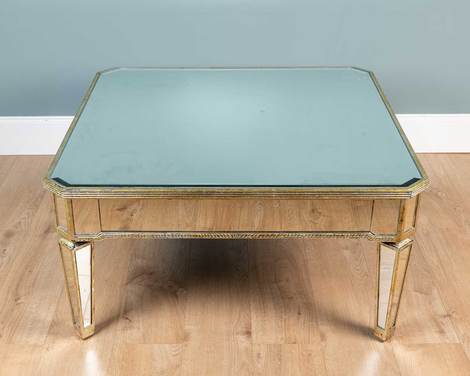 Lot 25 - A mirrored coffee table