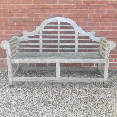 Lot 1515 - A Lutyens-style teak garden bench
