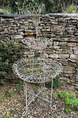 Lot 1455 - A wrought iron three-tier conservatory plant stand