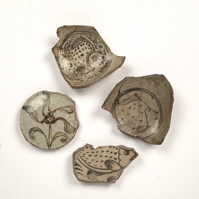 Lot 159 - Four grey pottery fragments of dishes Islamic...