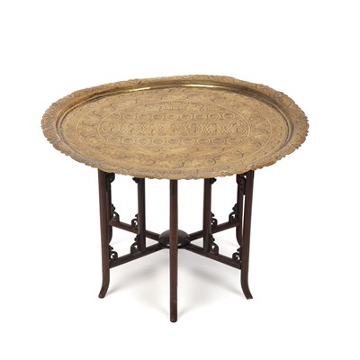 Lot 104 - A late 19th century eastern brass topped table...