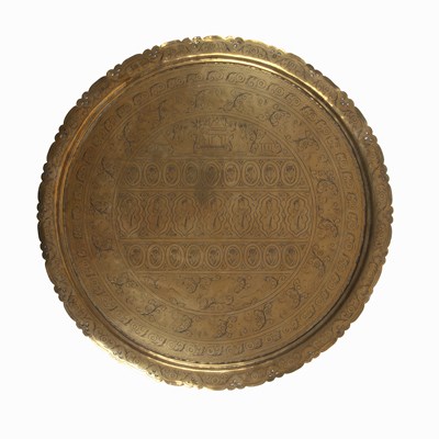 Lot 104 - A late 19th century eastern brass topped table...