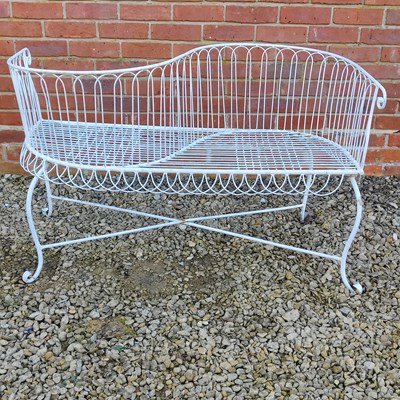 Lot 1570 - A white-painted metal garden conversation seat